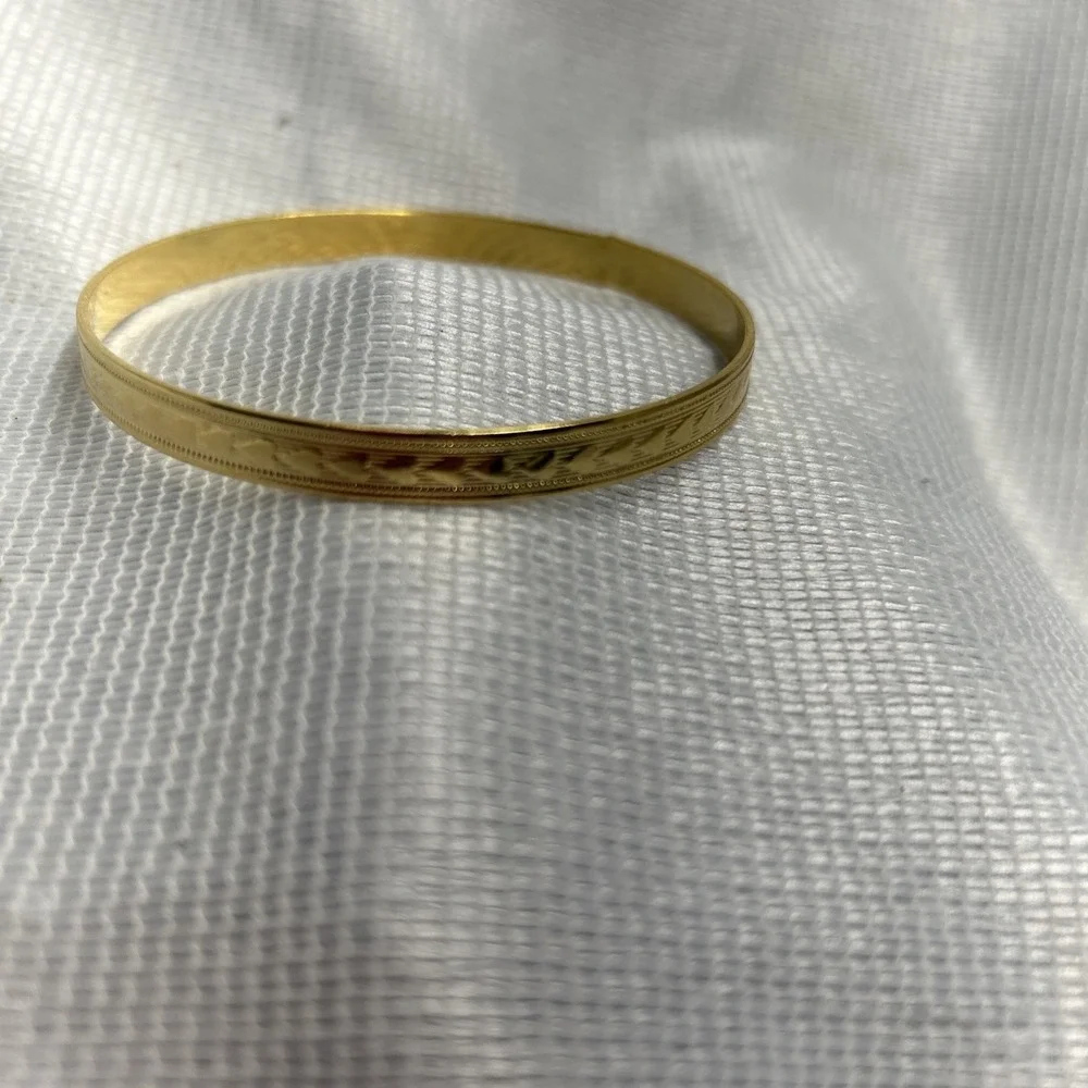 Gold Tone Heart Engraved Bangle Bracelet Measuring 2 3/4 Inches Across